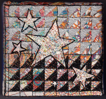 This is an embroidered square of stars and spirals