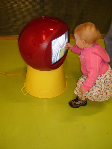 little girl looks at my video